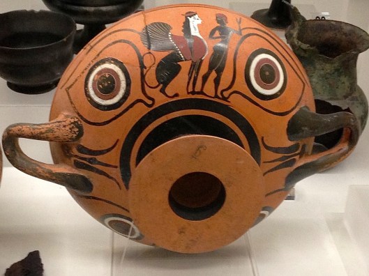 Bowl with mask-like design.